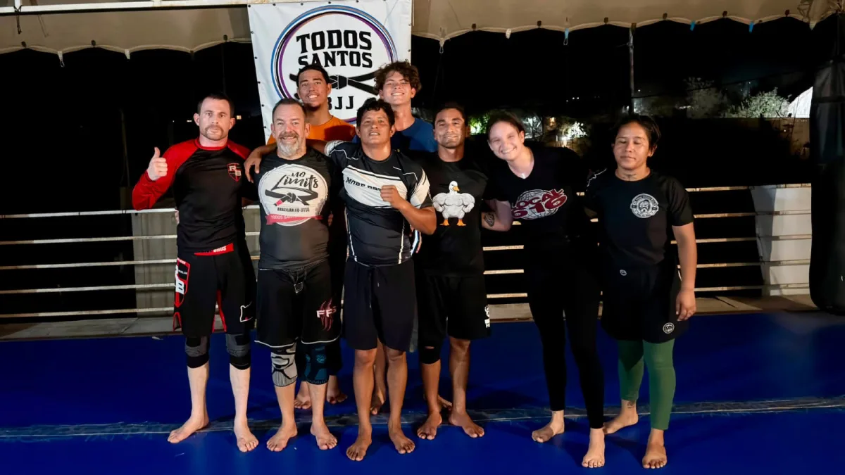 Eight adults standing together after training at Todos Santos BJJ