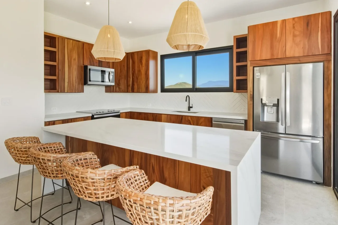 Finished kitchen with wood cabinetry at THE HALO OVER CERRITOS in Cerritos